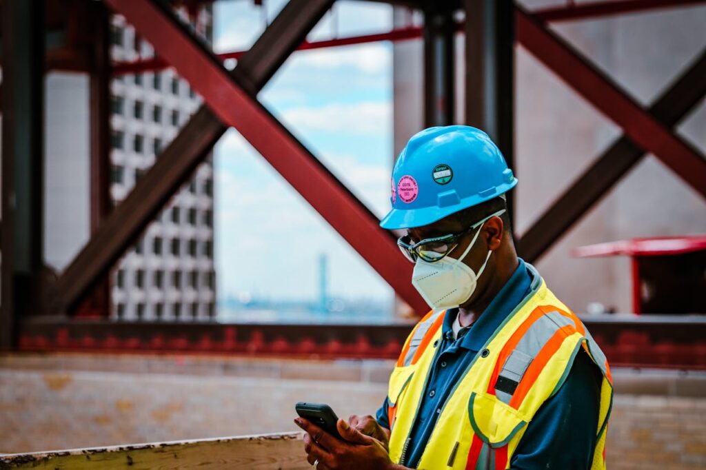 Contractor checking GPS tracking on mobile phone