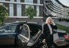 Executive using luxury chauffeur service in Cape Town for professional business travel