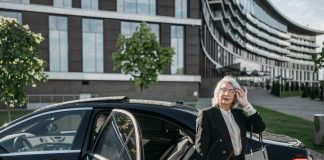Executive using luxury chauffeur service in Cape Town for professional business travel