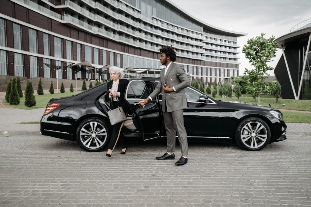 Professional private driver in Cape Town assisting executive passenger with travel